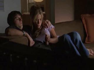 Jerking off guy's dick while watching TV