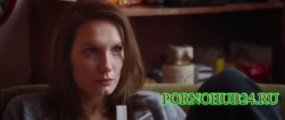 A prostitute smears her body with oil for cellulite